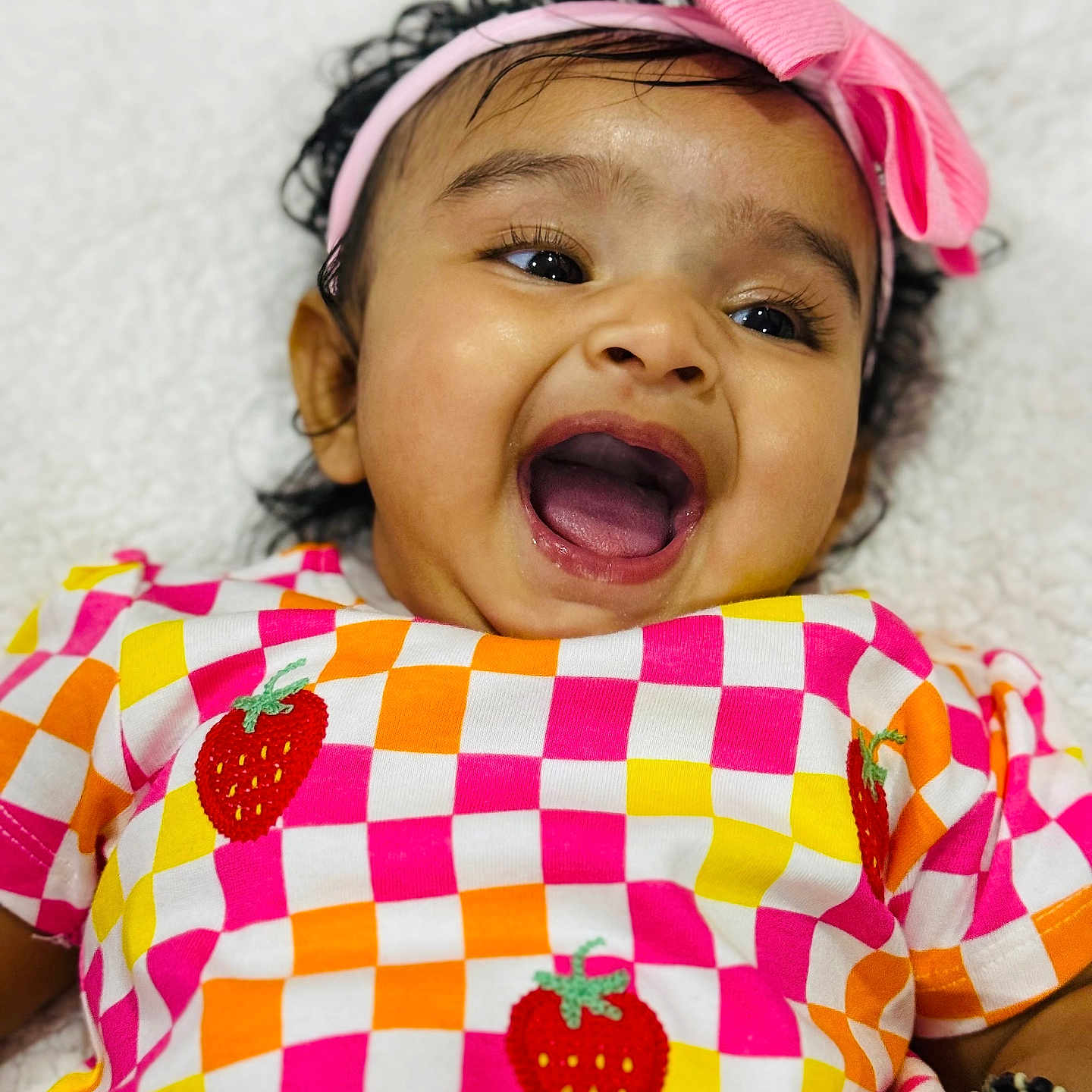 Shloka is registered to the contest to win money with this photo: accessories, baby, babylaughing, bodypart, bracelet, clothing, dress, earring, face, happy, head, headband, jewelry, laughing, mouth, person, photography, portrait, smile, t_shirt