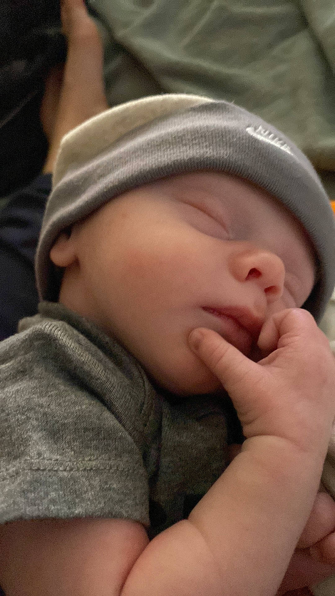 Jimmy is registered to the contest to win money with this photo: baby, baby_toddler_clothing, cheek, child, chin, close_up, comfort, eyelash, finger, gesture, grass, hand, happy, lip, mouth, nail, nose, person, skin, thumb