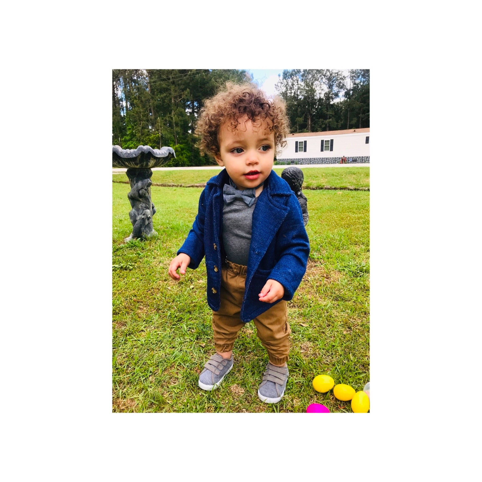 Konnor is registered to the contest to win money with this photo: baby, ball, child, footwear, grass, happy, jacket, lawn, outerwear, person, plant, play, shoe, sleeve, smile, t_shirt, toddler
