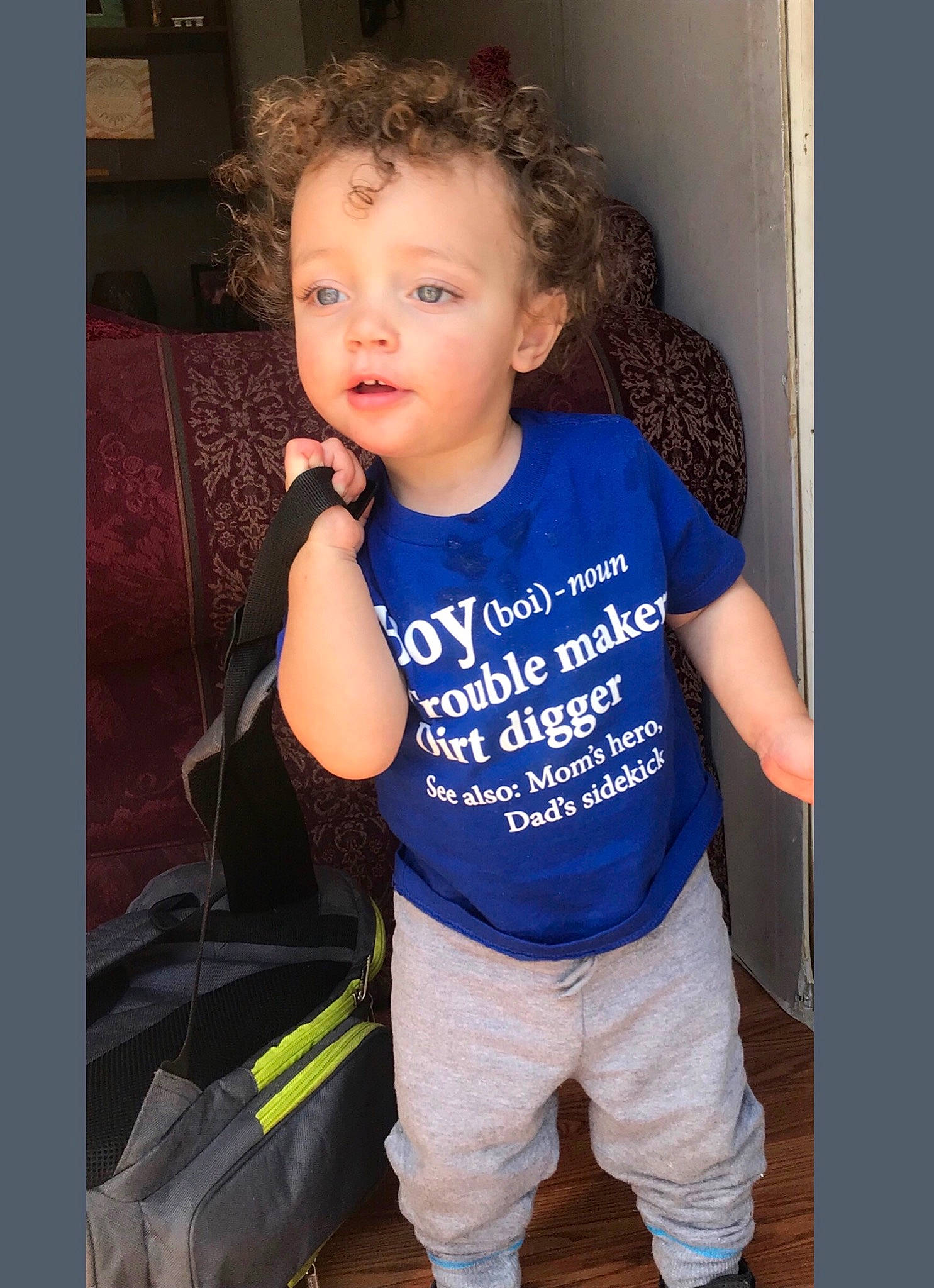 Konnor is registered to the contest to win money with this photo: arm, child, child_model, person, sleeve, smile, standing, t_shirt, toddler