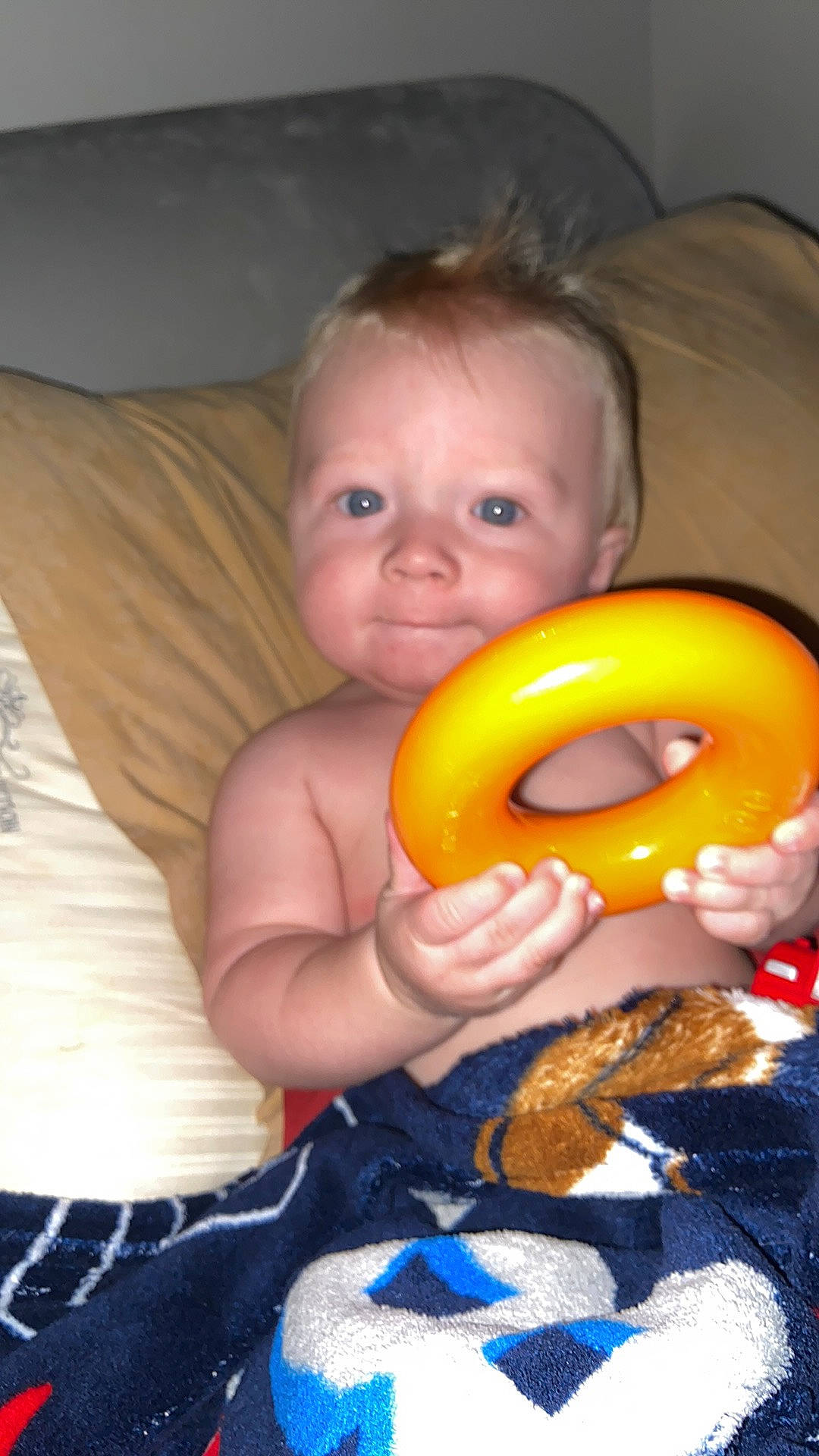 Ezra is registered to the contest to win money with this photo: arm, baby, baby_playing_with_toys, cheek, eye, finger, fun, happy, head, human_body, iris, mouth, nose, orange, person, pumpkin, skin, smile, toddler, toy