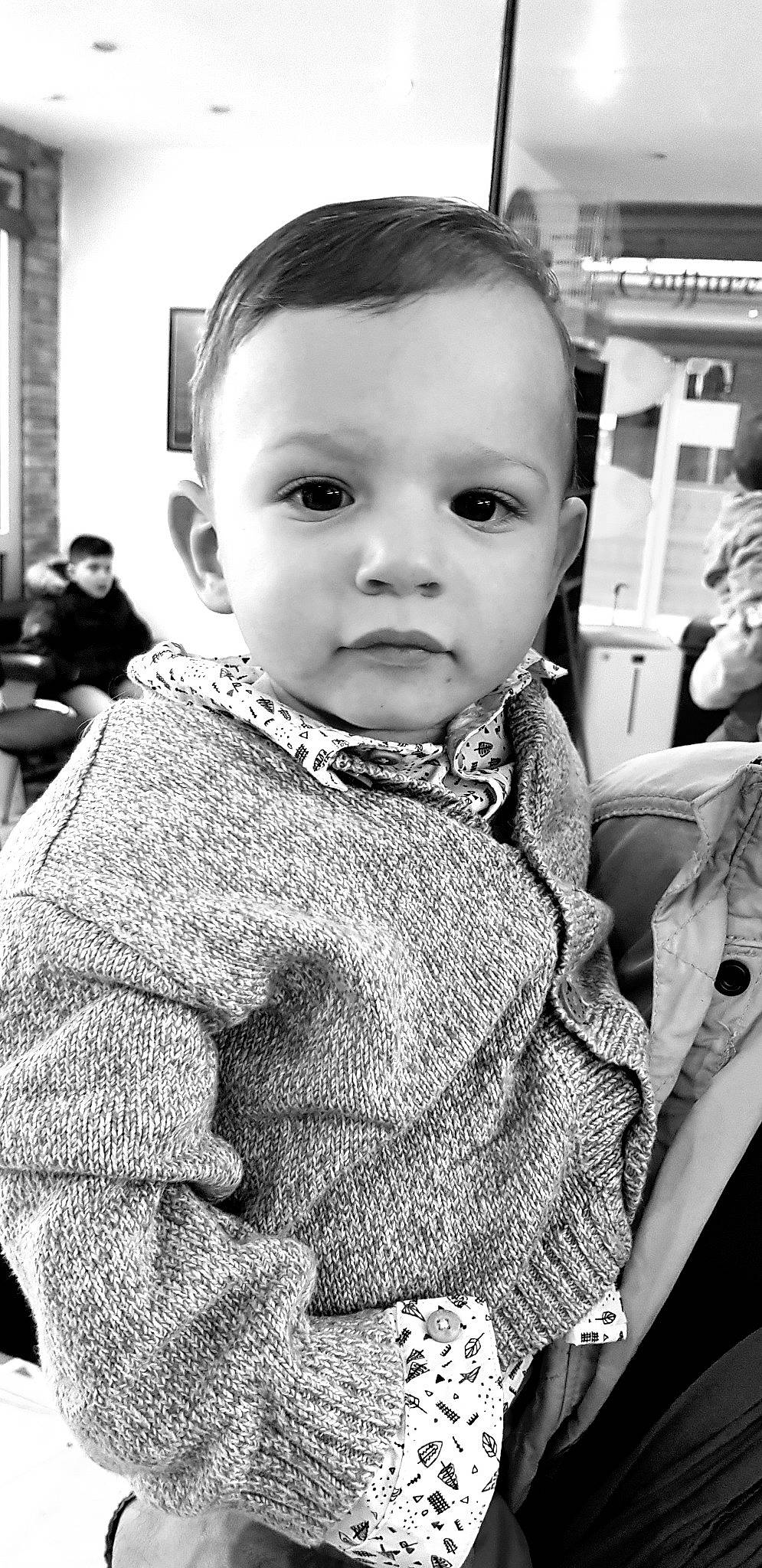 Nahim participe au concours pour gagner de l'argent avec cette photo : baby, black, black_and_white, cheek, child, eye, face, facial_expression, head, human, monochrome, monochrome_photography, outerwear, people, person, photograph, photography, skin, smile, snapshot