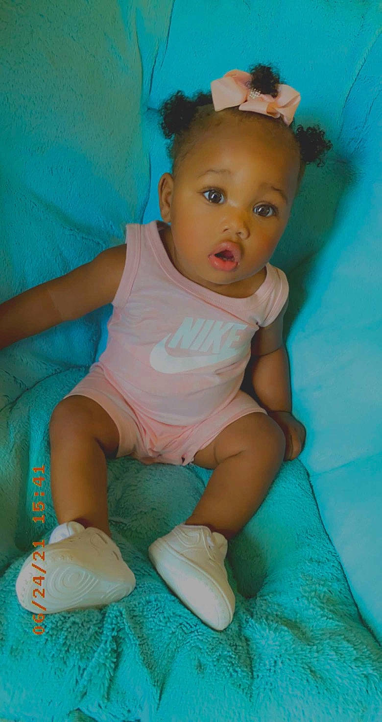 Kyilee is registered to the contest to win money with this photo: abdomen, aqua, azure, baby, baby_toddler_clothing, cheek, chest, finger, head, human_body, iris, leg, mouth, organ, person, pink, skin, surprise, textile, thigh