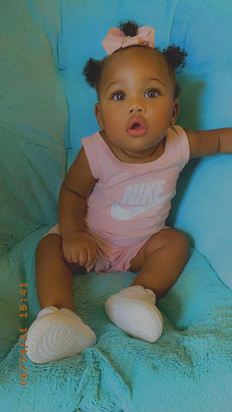 Kyilee is registered to the contest to win money with this photo: baby, baby_toddler_clothing, cheek, child, comfort, finger, fun, happy, human_body, iris, leg, mouth, neck, nose, person, skin, sleeve, sock, surprise, thigh