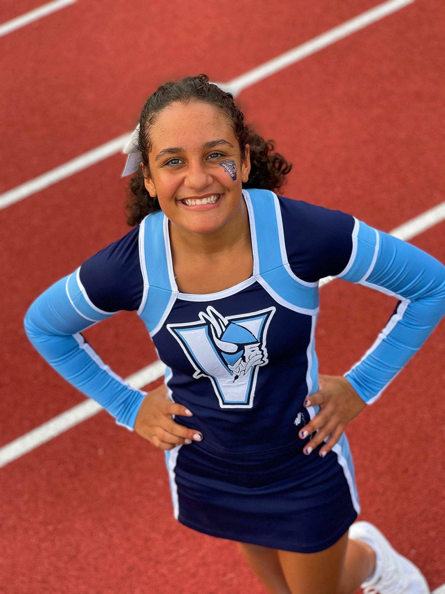 Domanique is registered to the contest to win money with this photo: athlete, athletics, championship, cheerleading_uniform, competition, competition_event, electric_blue, event, human_leg, jersey, joy, knee, person, player, smile, sports, sports_uniform, sportswear, thigh, tournament