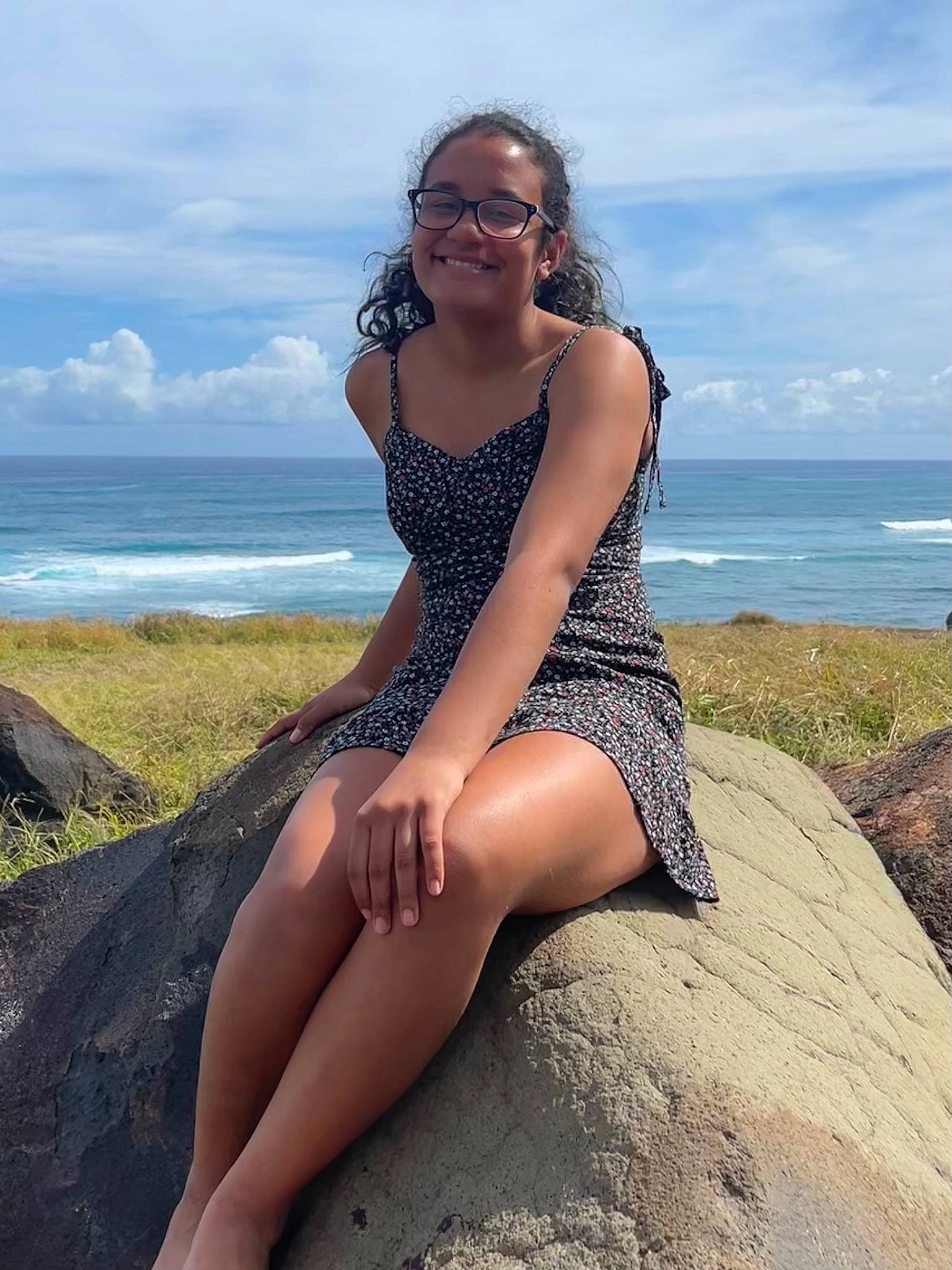 Domanique is registered to the contest to win money with this photo: azure, black_hair, cloud, face, flash_photography, hair, hairstyle, happy, human_body, joy, knee, leg, neck, people_in_nature, person, sand, sky, smile, sunglasses, thigh