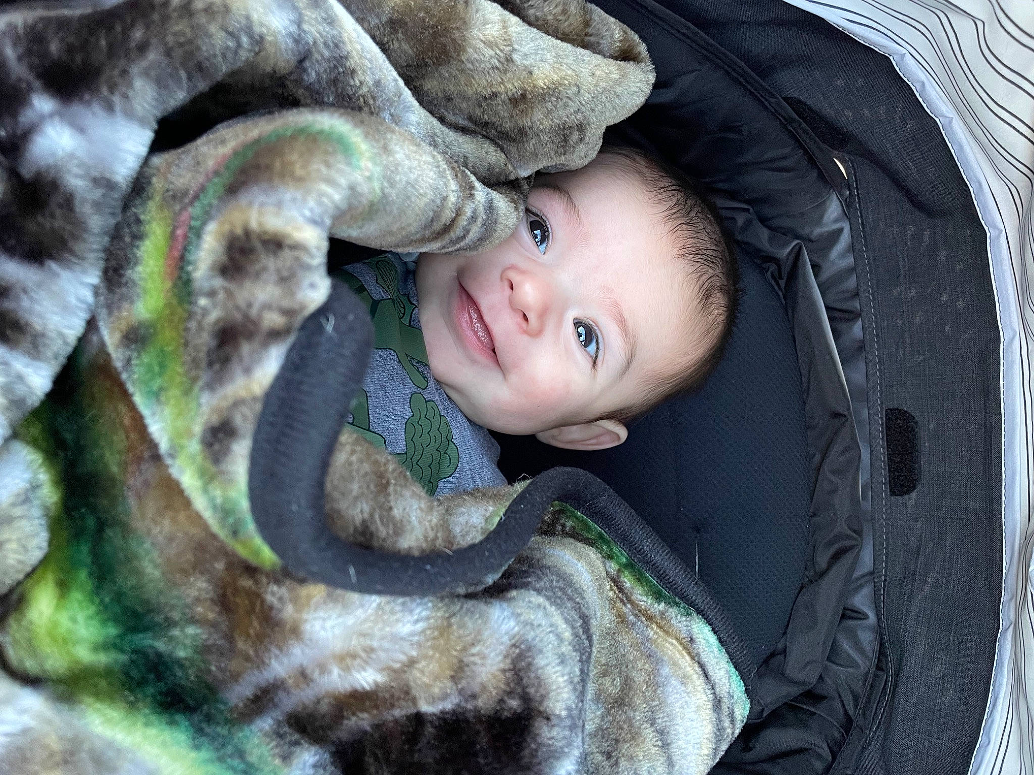 Xayvian is registered to the contest to win money with this photo: baby, baby_products, child, comfort, eye, flash_photography, fur, grass, happy, iris, outerwear, person, plant, portrait_photography, sitting, skin, smile, toddler, tree, wood