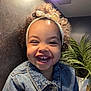 baby, babylaughing, blonde, clothing, coat, face, hair, happy, head, jacket, jeans, laughing, lighting, pants, person, photography, plant, portrait, pottedplant, smile