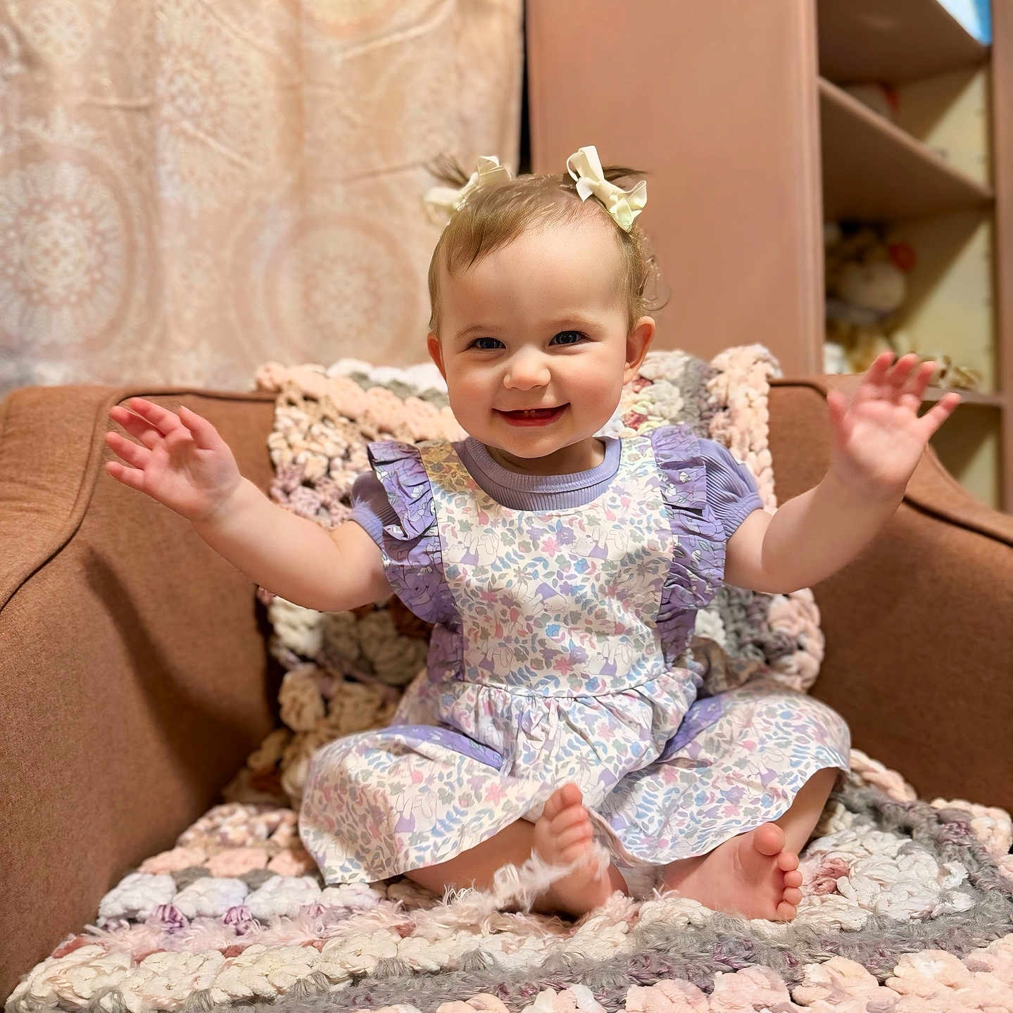 Summer is registered to the contest to win money with this photo: accessories, baby, bodypart, clothing, couch, cushion, dress, face, finger, furniture, hand, happy, head, homedecor, pants, person, photography, portrait, sitting, smile