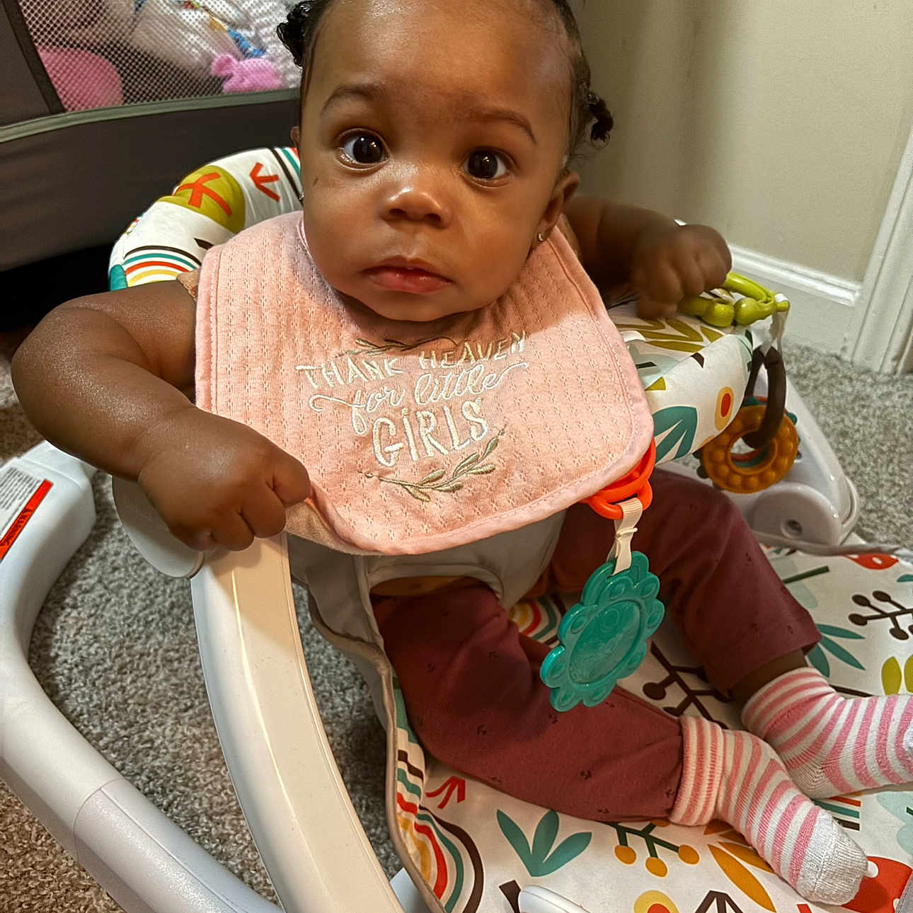 Kennedi is registered to the contest to win money with this photo: applique, baby, bib, bodypart, chair, clothing, couch, cushion, face, finger, furniture, hand, head, homedecor, hosiery, person, photography, portrait, sitting, sock