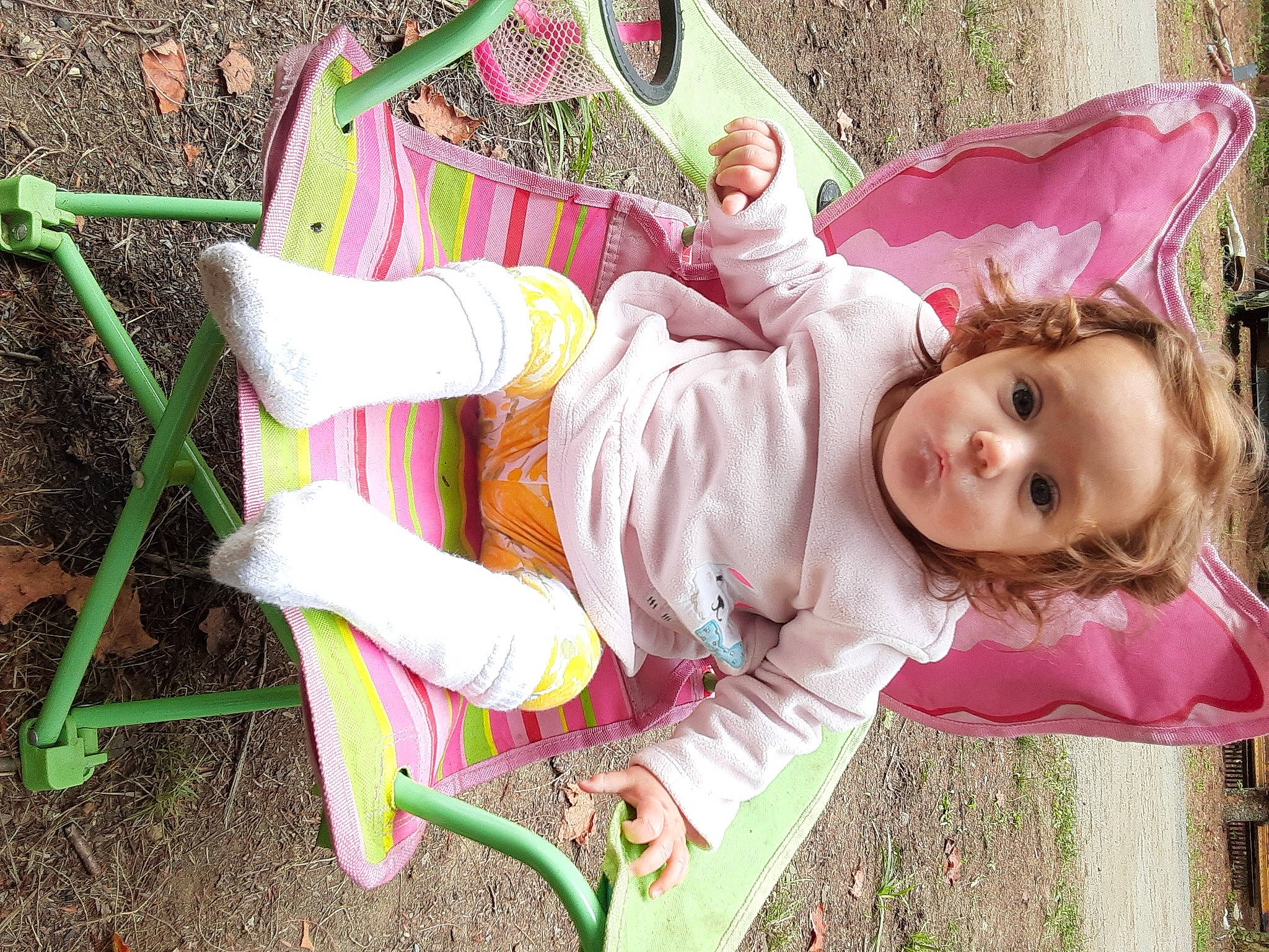 Aiyanna joined the competition — help win amazing prizes! baby, baby_toddler_clothing, child, costume, fun, grass, happy, leisure, magenta, pattern, people_in_nature, person, pink, plant, play, recreation, sitting, spring, toddler, tree