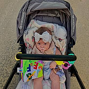 Sailor joined the competition — help win amazing prizes! baby, stroller, blanket, pacifier, headband, toy, baby_clothing, socks, outdoor, infant, cute, child, person, walking, seat, plaything, fabric, comfort, baby_toy, expression