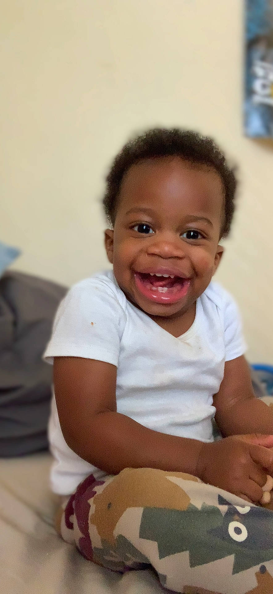 Ezra is registered to the contest to win money with this photo: baby, baby_playing_with_toys, chair, cheek, child, comfort_food, eye, fun, hand, happy, joy, laugh, nose, person, room, sitting, skin, smile, t_shirt, tableware