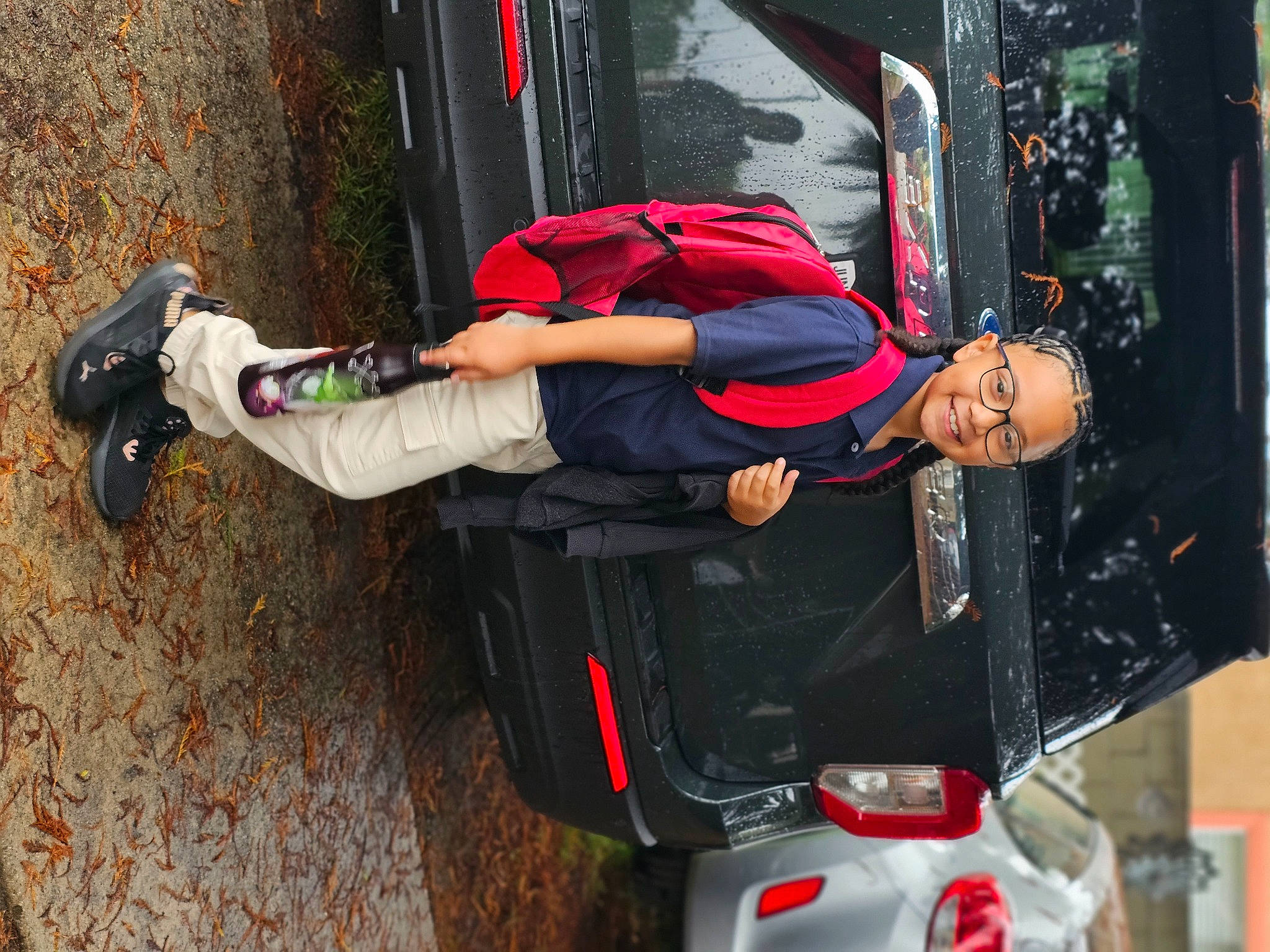 Sydney joined the competition — help win amazing prizes! adventure, auto_part, automotive_design, automotive_exterior, automotive_lighting, bag, bumper, carmine, family_car, fun, joy, luggage_and_bags, machine, motor_vehicle, outdoor_shoe, person, recreation, red, smile, vehicle