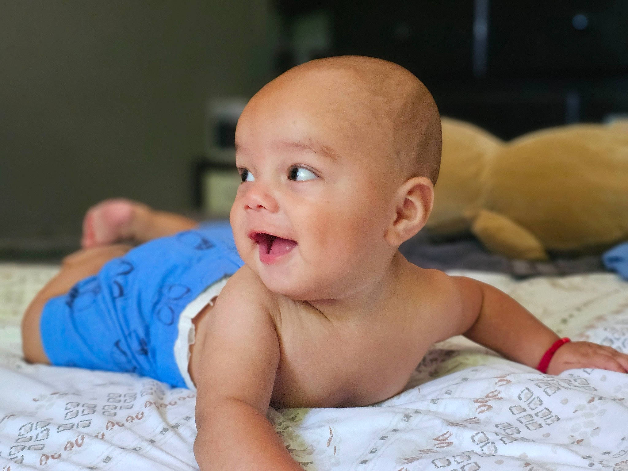 Aiden joined the competition — help win amazing prizes! baby, baby_products, baby_toddler_clothing, cheek, chest, child, comfort, fun, happy, iris, laugh, linens, person, portrait_photography, room, sitting, skin, smile, thumb, toddler