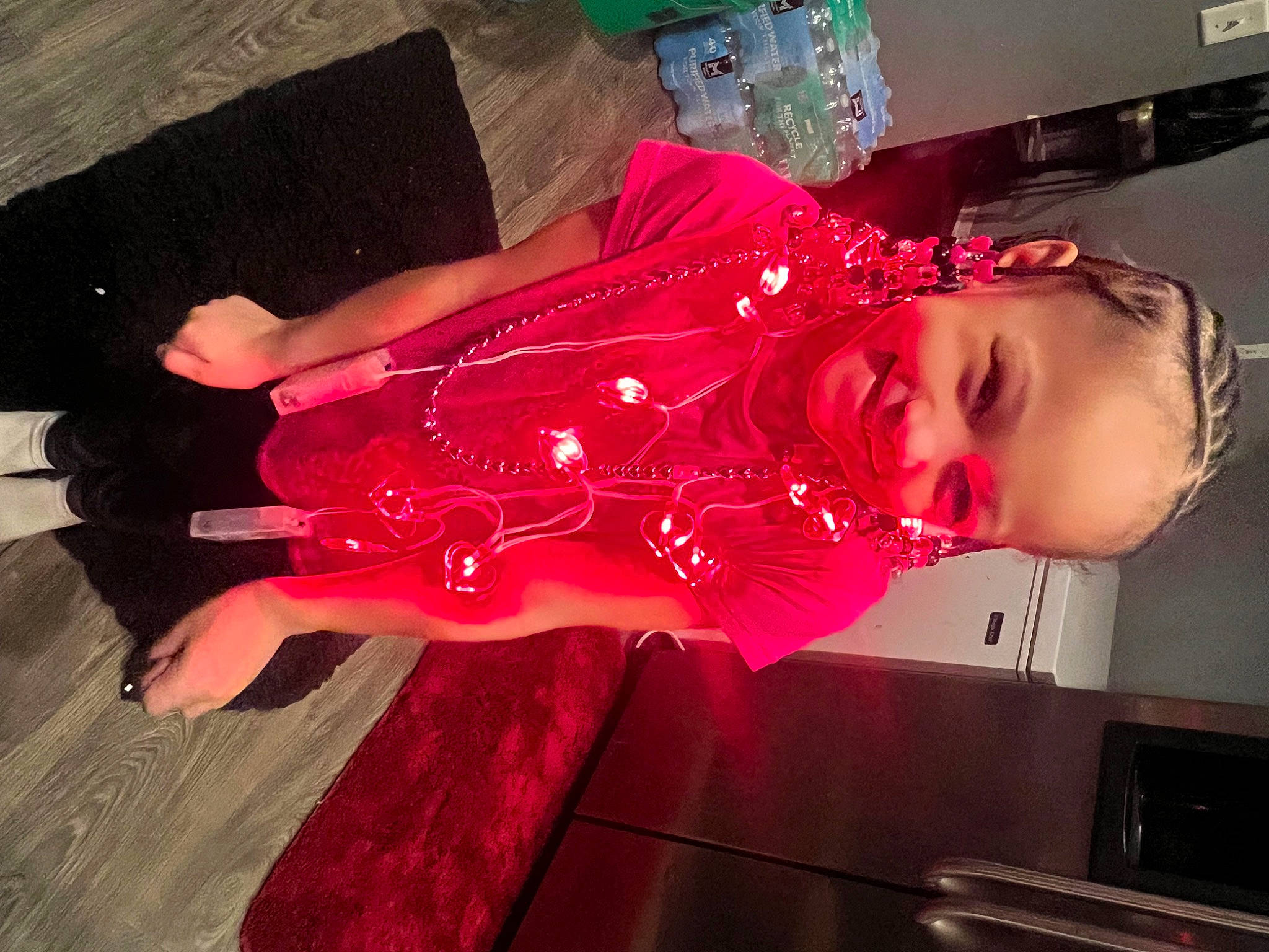 Makyla is registered to the contest to win money with this photo: child, dress, entertainment, event, fashion_design, flesh, flooring, fun, hardwood, human_leg, joy, magenta, person, pink, purple, room, smile, toddler, tree, violet