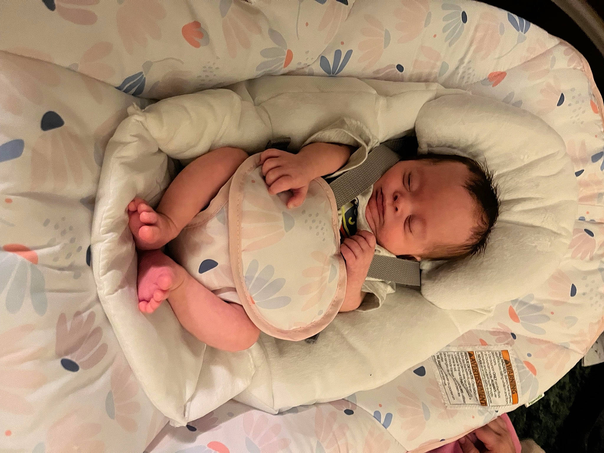 Evie is registered to the contest to win money with this photo: baby, baby_products, baby_toddler_clothing, bedtime, brown, carmine, cheek, child, comfort, face, finger, head, linens, pattern, person, product, skin, sleep, textile, thumb