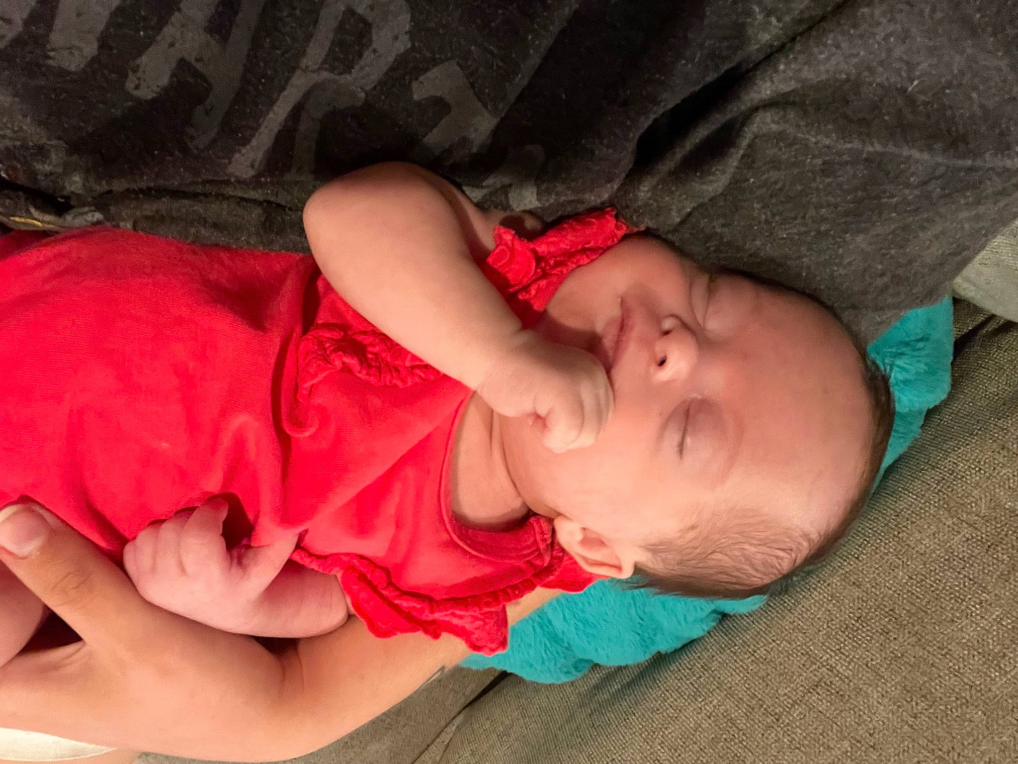 Evie is registered to the contest to win money with this photo: baby, baby_toddler_clothing, bedtime, cheek, child, comfort, finger, foot, human_leg, lap, mouth, nail, nap, person, sitting, skin, sleep, sleeve, thigh, toddler