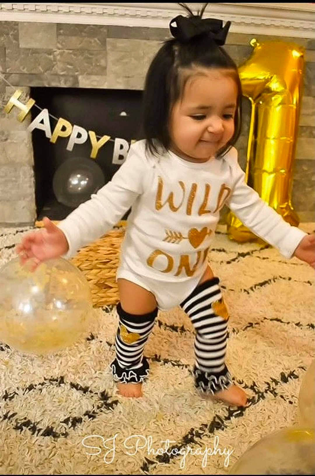 Izayla is registered to the contest to win money with this photo: baby, baby_toddler_clothing, ball, child, flooring, fun, happy, human_leg, people_in_nature, person, photograph, play, sitting, sleeve, snapshot, sock, soil, t_shirt, thigh, toddler