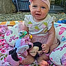 baby, blanket, blue_eyes, child, cushion, cute, flower_pattern, grass, happy, headband, nature, outdoor, pink, playtime, portrait, sitting, smiling, stuffed_toy, toddler, toy