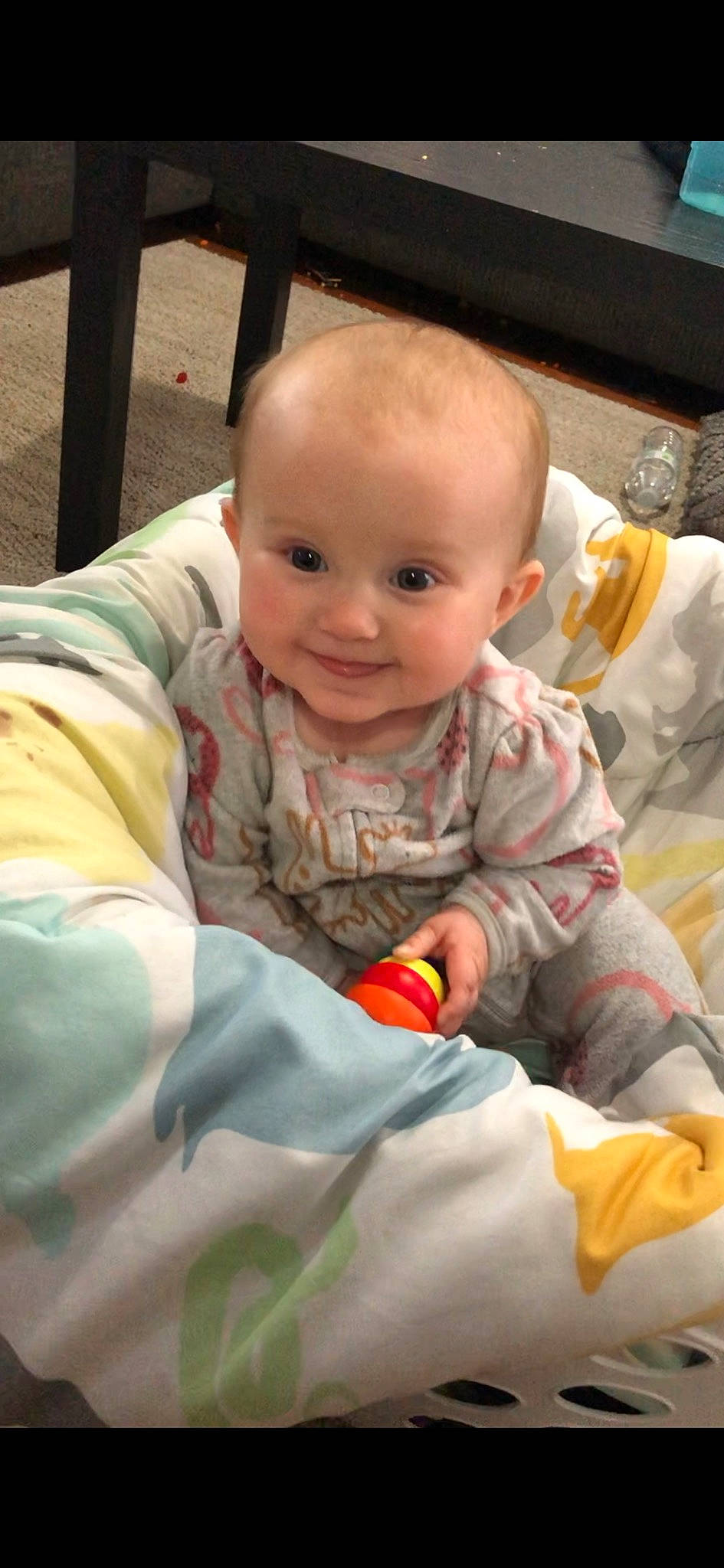 Luna is registered to the contest to win money with this photo: baby, baby_products, baby_toddler_clothing, cheek, child, comfort, finger, flooring, fun, grass, happy, joy, mammal, nose, person, product, room, sitting, skin, smile