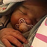 Lowen participe au concours pour gagner de l'argent avec cette photo : baby, sleeping, pacifier, hand, blanket, cozy, infant, cute, face, closeup, rest, comfort, soft, warm, child, toddler, nursery, peaceful, indoors, portrait