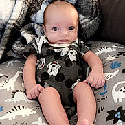 Ryker joined the competition — help win amazing prizes! baby, blanket, clothing, couch, cushion, face, furniture, hat, head, homedecor, linen, newborn, pants, person, photography, pillow, portrait, quilt, sitting, toy