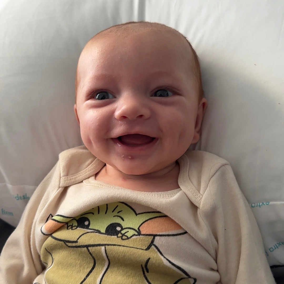Ryker joined the competition — help win amazing prizes! baby, babylaughing, clothing, couch, cushion, face, furniture, happy, head, homedecor, knitwear, laughing, pants, person, photography, portrait, smile, sweater, sweatshirt, t_shirt