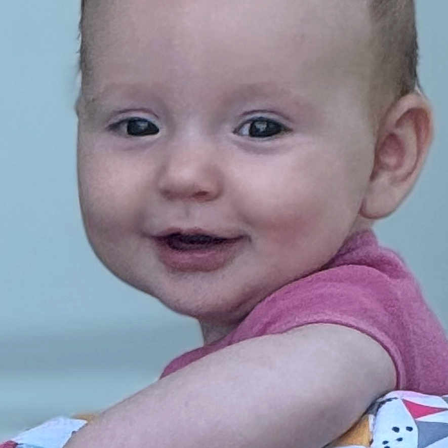 Maxine joined the competition — help win amazing prizes! baby, child, clothing, colorful, cushion, cute, expression, face, hand, happy, indoor, infant, patterned, person, playing, portrait, skin, smile, toy, young