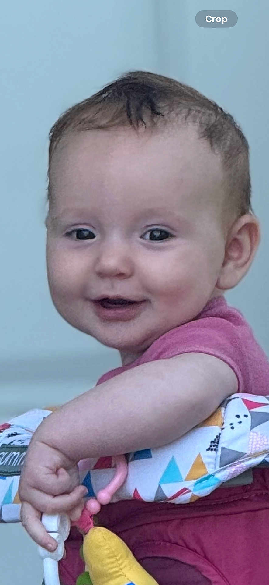 Maxine joined the competition — help win amazing prizes! baby, child, smile, face, hand, toy, colorful, patterned, cushion, clothing, indoor, happy, cute, infant, expression, portrait, playing, young, skin, person