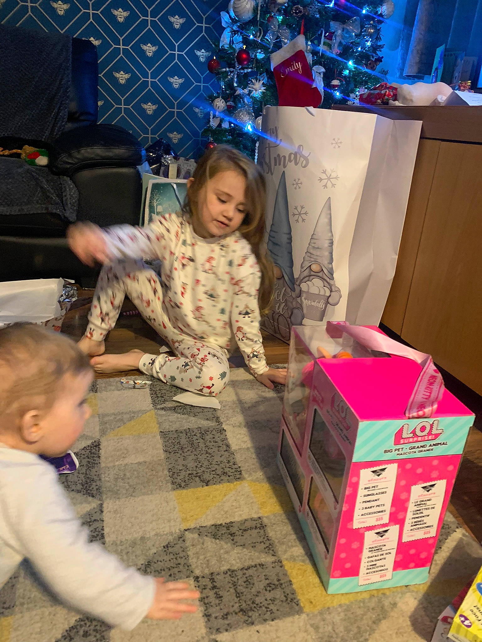 Maddie joined the competition — help win amazing prizes! baby, box, cardboard, carton, child, event, flooring, fun, holiday, magenta, package_delivery, packaging_and_labeling, packing_materials, pattern, person, play, room, shipping_box, sitting, toddler