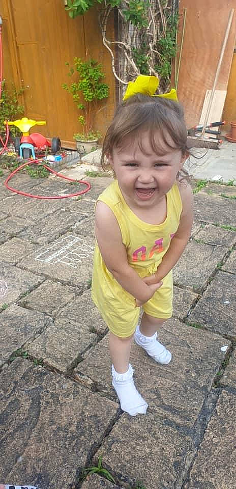 Emily is registered to the contest to win money with this photo: child, person, play, smile, toddler, yellow