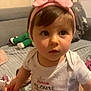 Selena a rejoint le concours — aidez-le/la à gagner de superbes lots ! baby, child, headband, pink, bow, sitting, blanket, toy, indoor, curious, clothing, diaper, face, person, couch, soft, infant, cute, warm_lighting, young