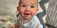 A.j. joined the competition — help win amazing prizes! baby, child, clothing, couch, cozy, cute, expression, face, feet, hands, happy, home, indoors, infant, natural_light, person, pillow, portrait, sitting, smiling