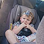 toddler, child, car_seat, baby_bottle, headband, blue_eyes, sitting, car_interior, seatbelt, cute, girl, clothing, milk, fingers, young_child, infant, car, safety_harness, portrait, casual
