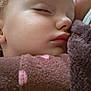 baby, sleeping, close_up, blanket, cozy, soft, face, child, peaceful, nap, pink, brown, polka_dots, skin, innocence, warm, comfort, portrait, head, eyelids