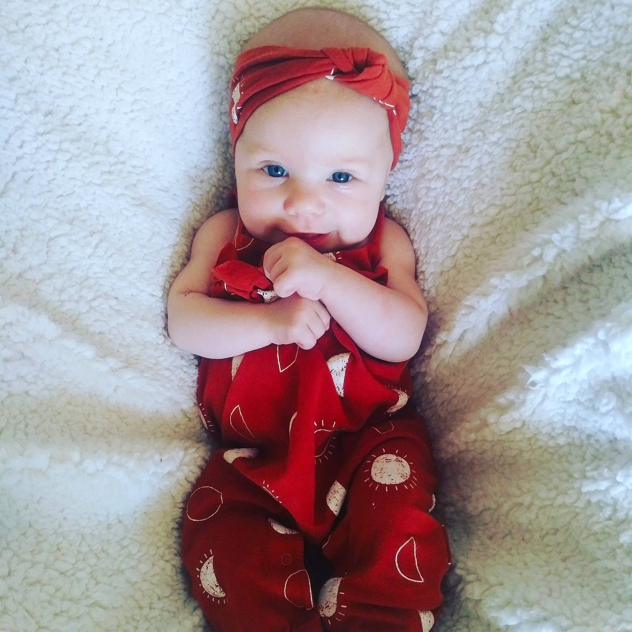 Natalie is registered to the contest to win money with this photo: baby, baby_toddler_clothing, brown_hair, cheek, costume_hat, doll, dress, eye, face, head, headwear, lip, magenta, nail, pattern, peach, person, skin, sleeve, textile