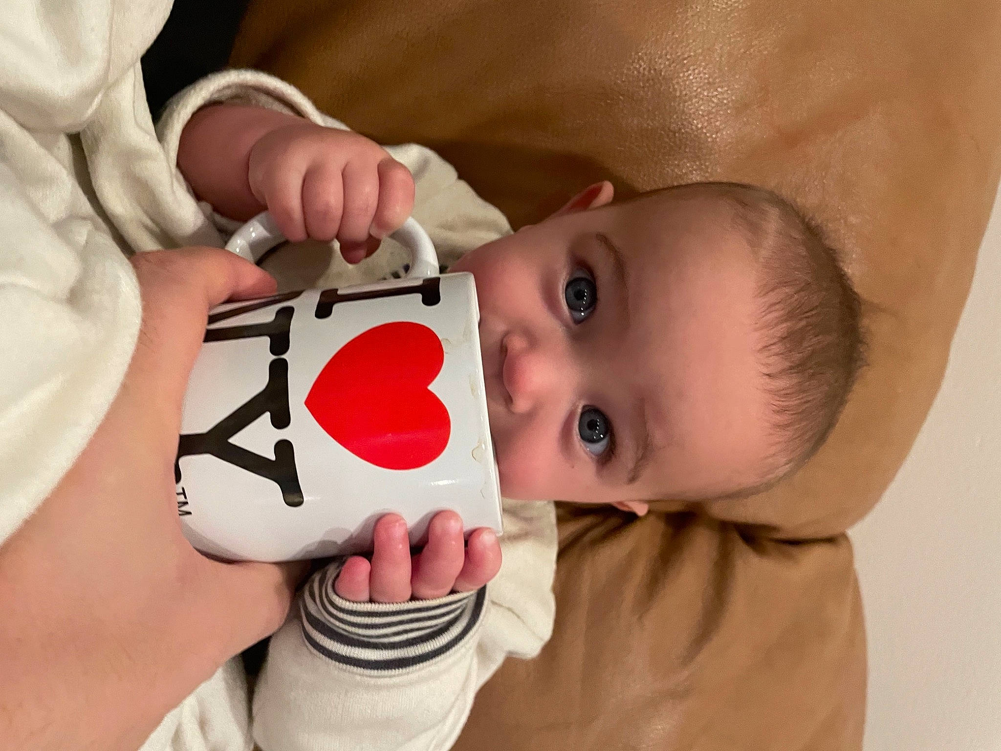 Katy is registered to the contest to win money with this photo: arm, cheek, chin, drinkware, eyelash, facial_expression, finger, gesture, hairstyle, hand, happy, human_body, joint, lip, mouth, neck, nose, person, skin, textile