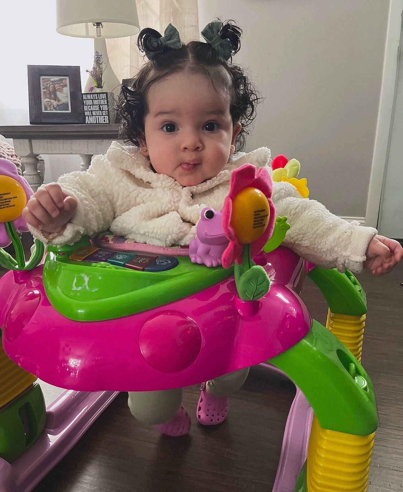 Milani is registered to the contest to win money with this photo: baby, baby_playing_with_toys, baby_products, baby_toddler_clothing, baby_toys, child, event, fun, happy, leisure, magenta, person, pink, play, purple, riding_toy, room, sitting, smile, toddler
