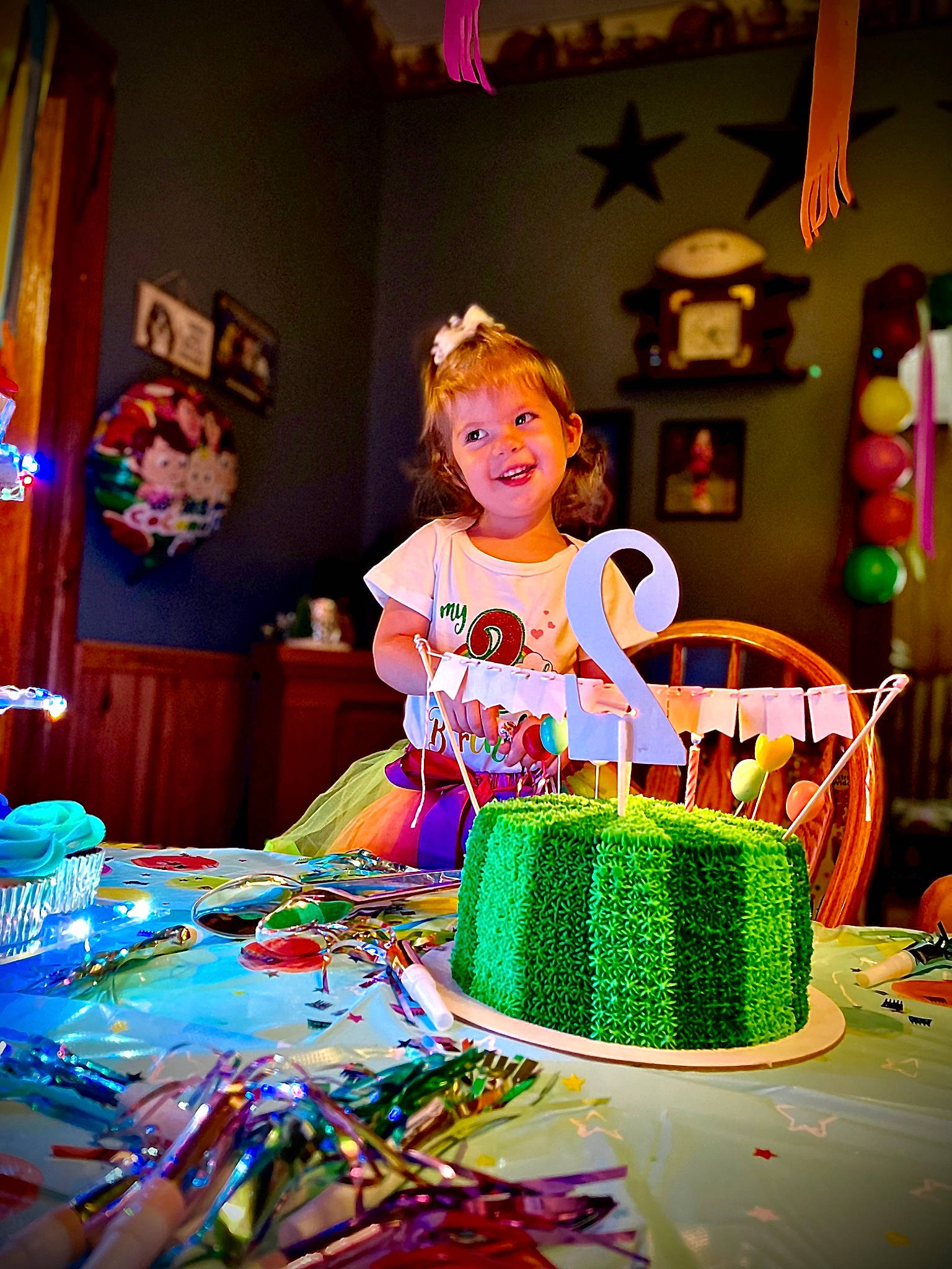 Natalie Grace is registered to the contest to win money with this photo: birthday_cake, birthday_party, cake, cake_decorating, cake_decorating_supply, curtain, decoration, dessert, event, food, fun, happy, hat, joy, lighting, party_supply, person, purple, smile, sugar_cake