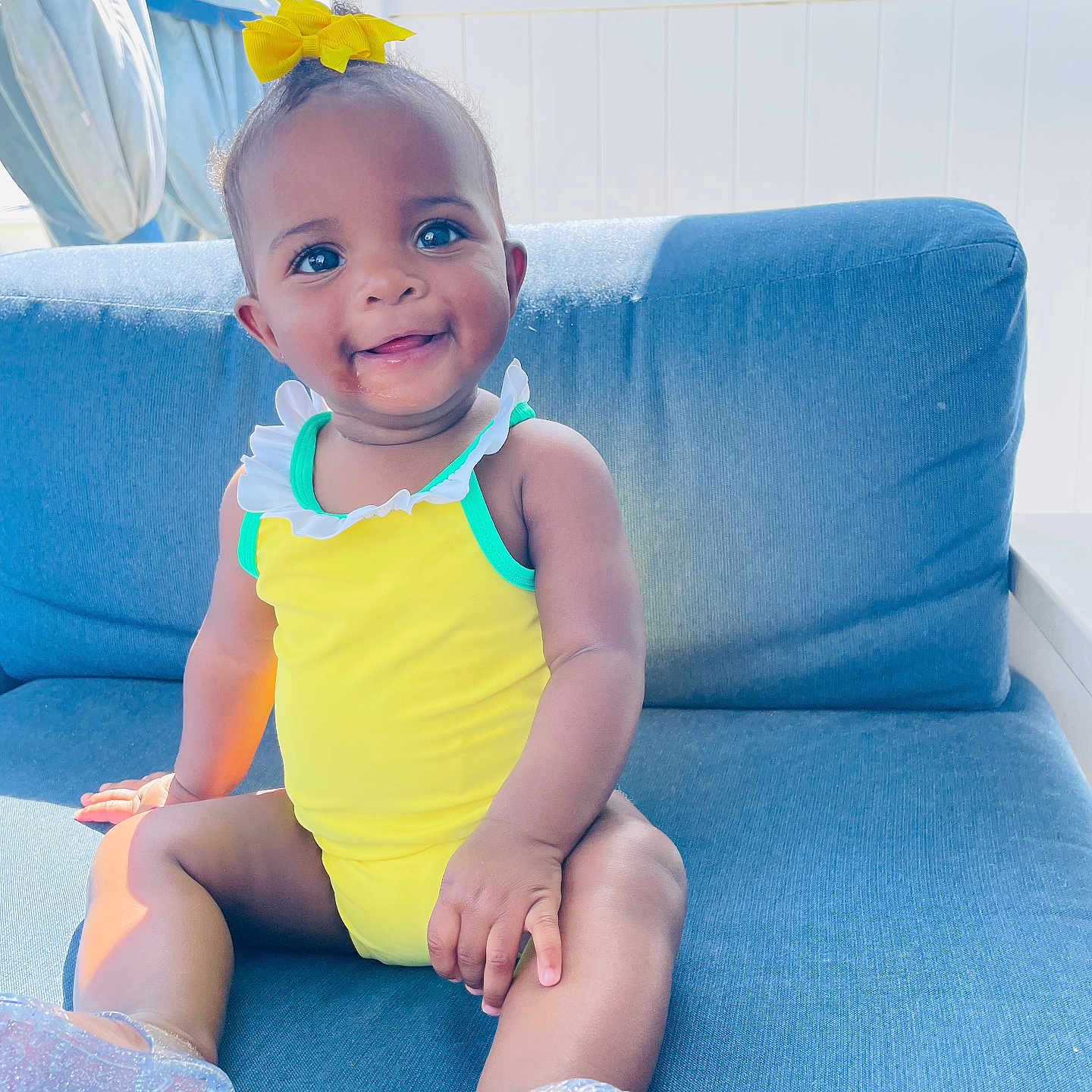 Kaidence is registered to the contest to win money with this photo: architecture, baby, building, chair, clothing, couch, cushion, face, furniture, happy, head, homedecor, indoors, livingroom, person, photography, portrait, room, sitting, smile