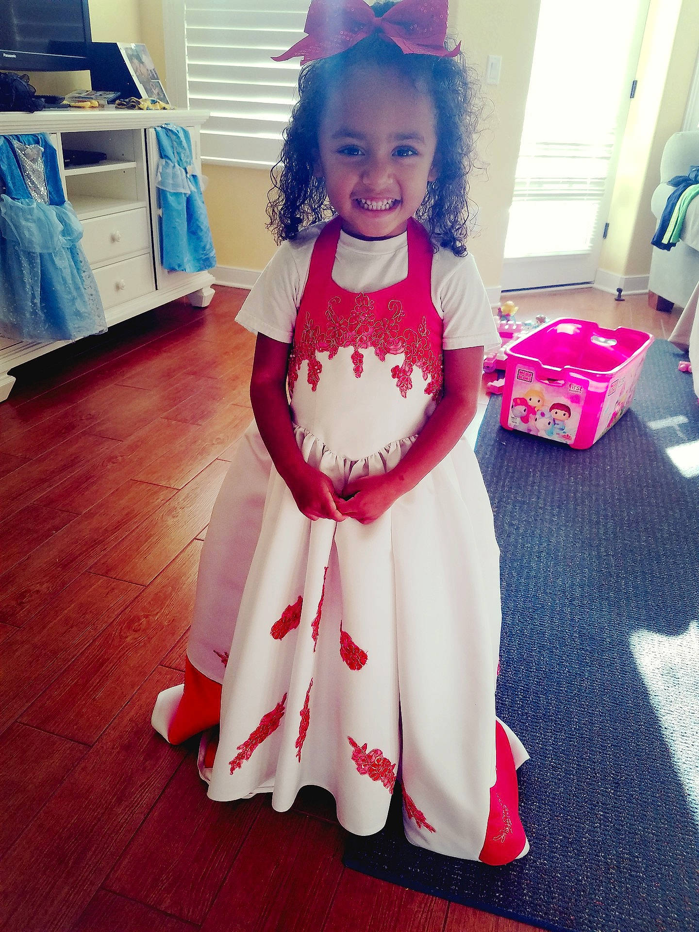 Jessenia is registered to the contest to win money with this photo: child, costume, dance_dress, day, design, dress, fun, girl, gown, joy, magenta, outerwear, pattern, person, pink, product, red, skin, textile, toddler