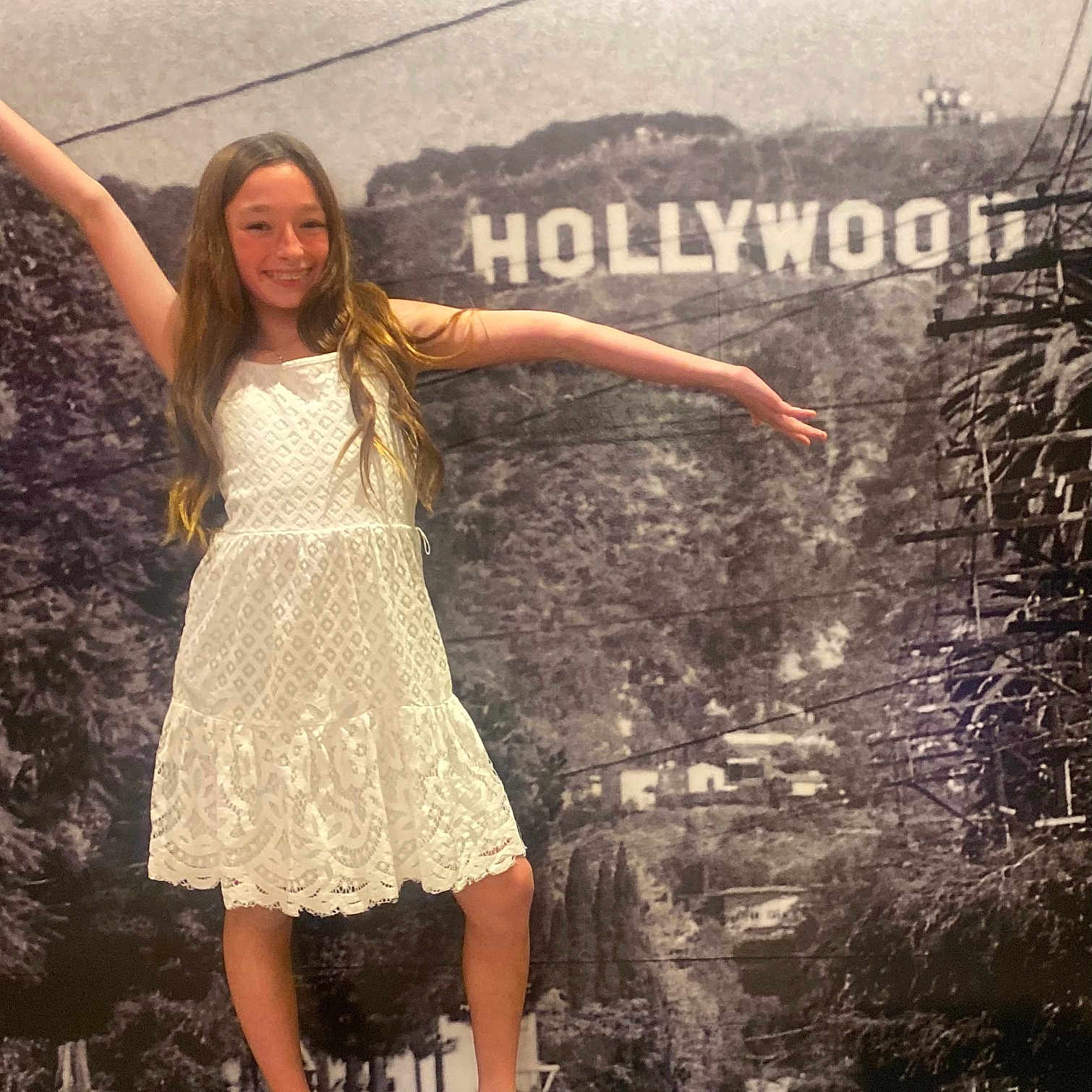Brileigh joined the competition — help win amazing prizes! adult, bridge, clothing, dress, face, female, footwear, head, hollywoodsign, landmark, person, sandal, skirt, sleeve, woman