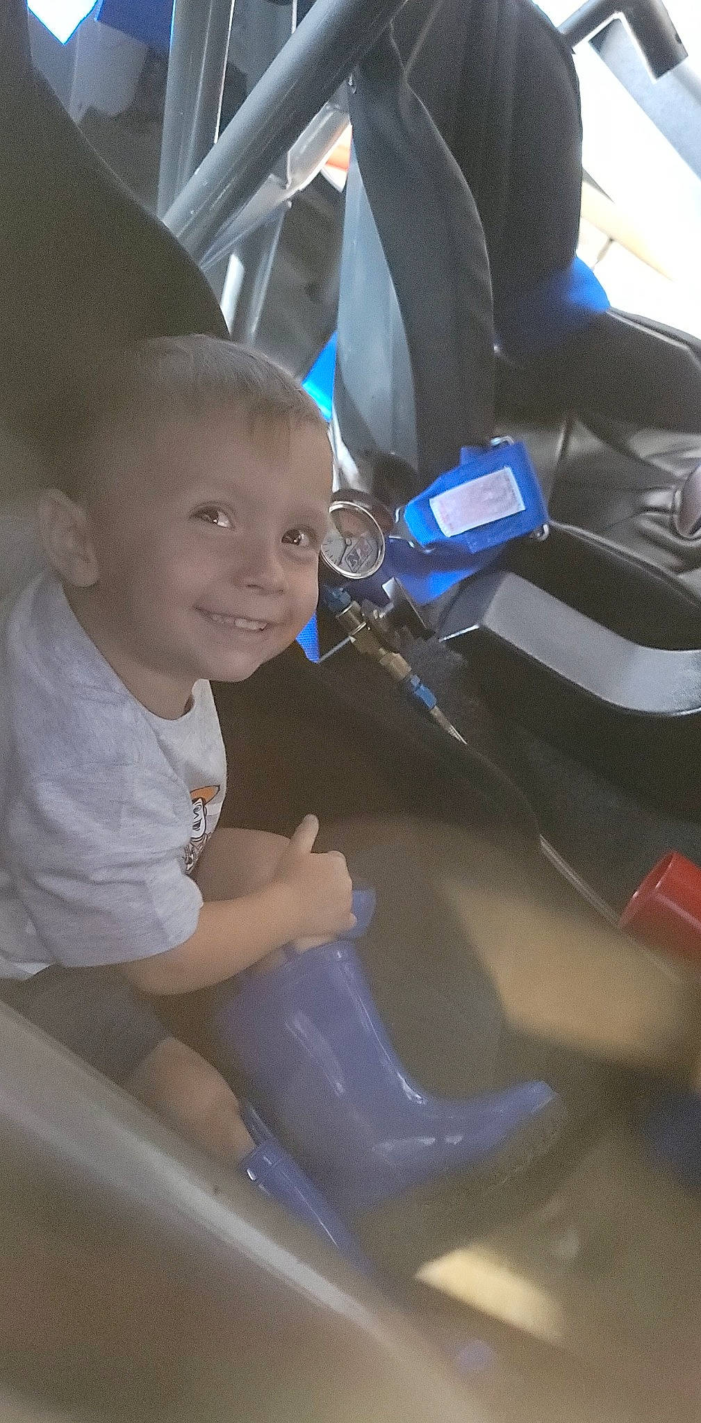 Kayson joined the competition — help win amazing prizes! automotive_design, automotive_exterior, automotive_lighting, automotive_tire, bumper, child, electric_blue, finger, fun, hairstyle, happy, hood, human, joy, motor_vehicle, motorcycle_helmet, person, personal_protective_equipment, smile, steering_wheel