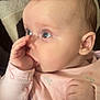 Romi joined the competition — help win amazing prizes! baby, infant, child, face, hand, thumb_sucking, pink_clothing, floral_pattern, closeup, blue_eyes, cute, portrait, skin, ear, nose, expression, soft_light, indoors, resting, background