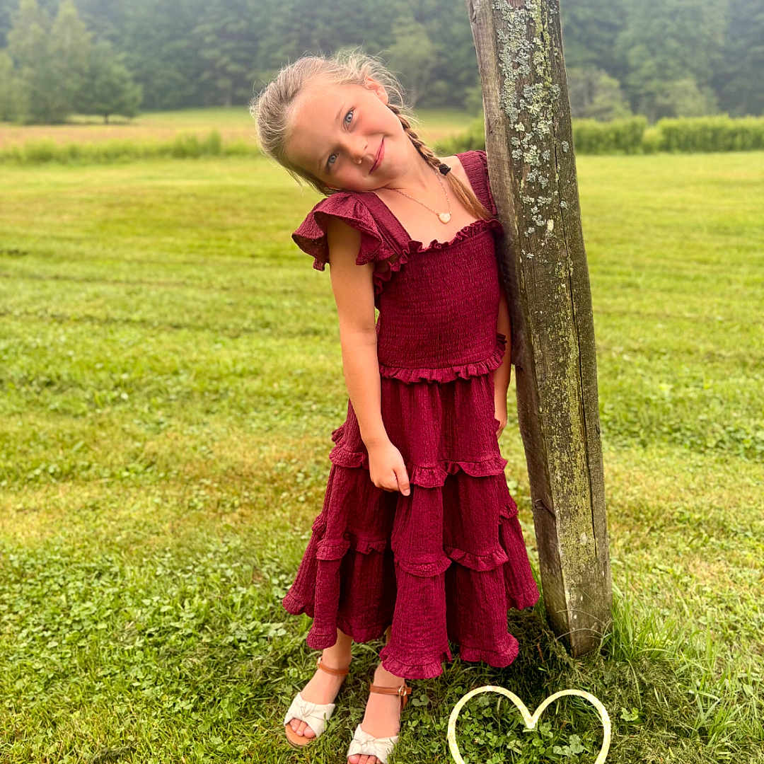 Sailor joined the competition — help win amazing prizes! child, girl, dress, red_dress, grass, outdoor, field, tree, wooden_post, nature, greenery, smile, braid, footwear, sandals, heart_doodle, sparkles, portrait, cute, playful