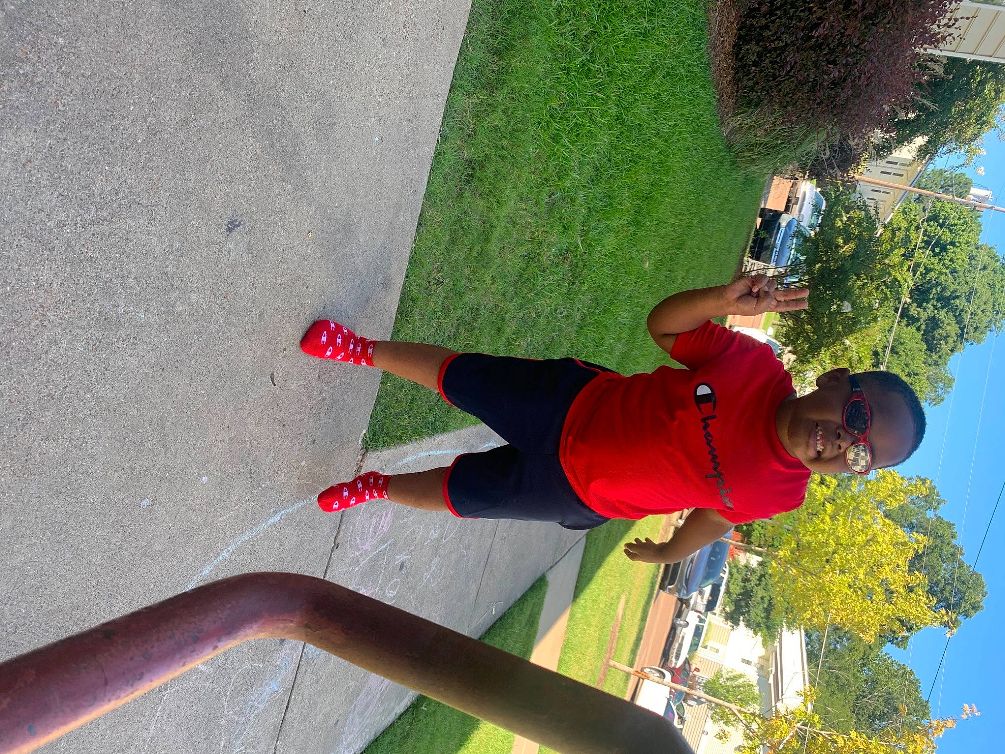 Makhi is registered to the contest to win money with this photo: active_pants, arm, balance, clothing, fun, grass, green, human_leg, knee, leg, leisure, people_in_nature, person, plant, shorts, sky, sportswear, thigh, tree, waist