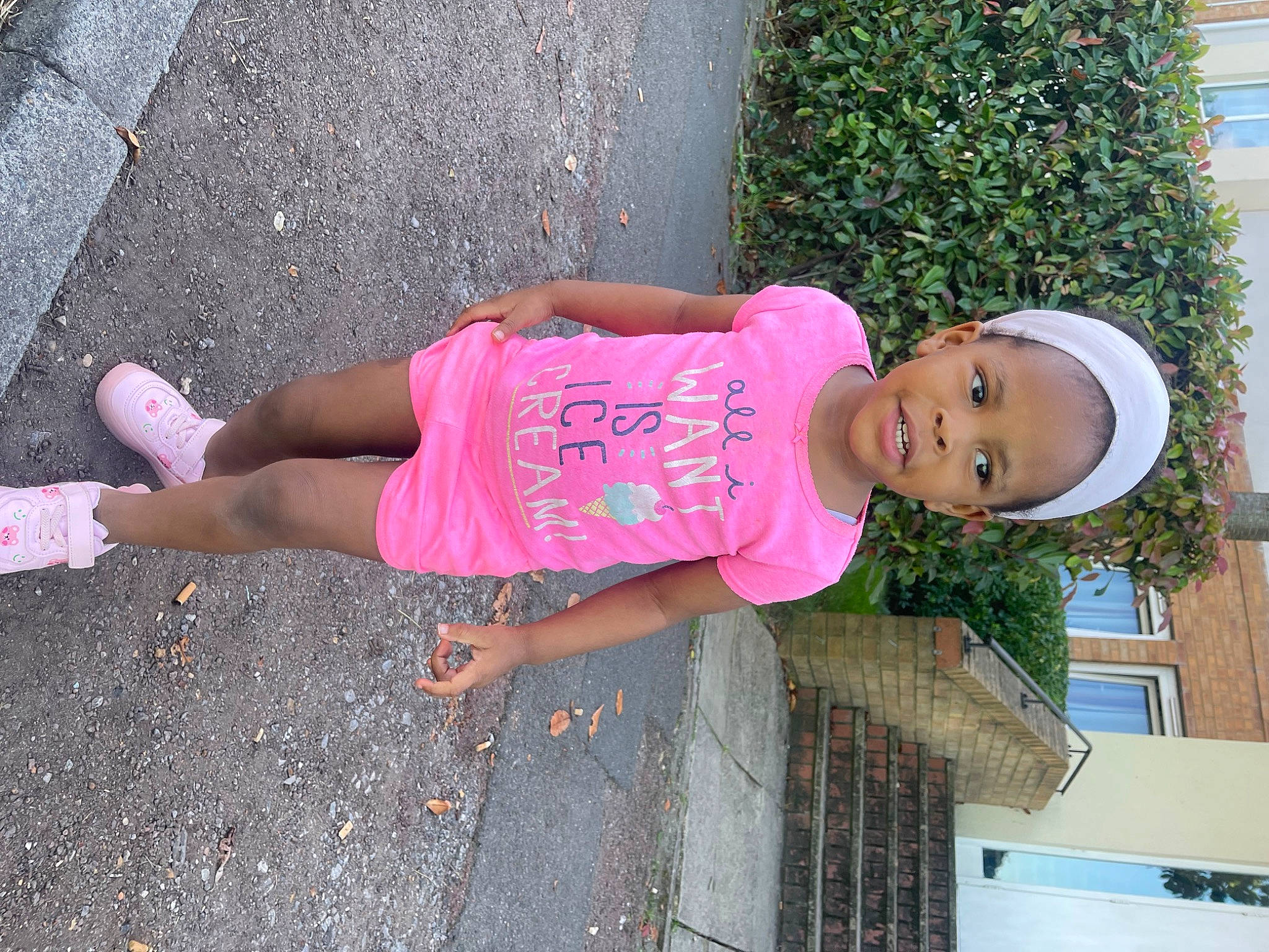 Glorious is registered to the contest to win money with this photo: asphalt, child, foot, fun, hat, human_leg, leisure, magenta, pattern, pedestrian, person, pink, plant, road_surface, sandal, sidewalk, t_shirt, thigh, toddler, waist
