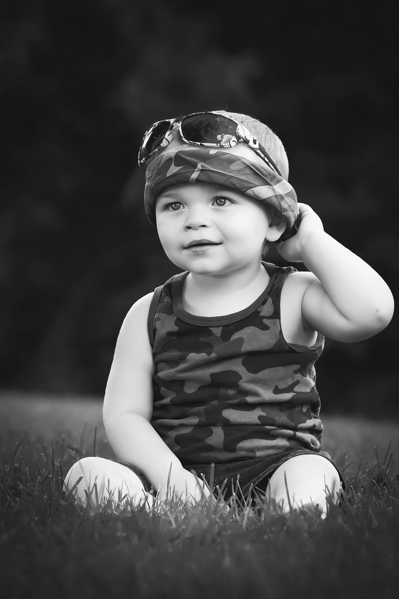 Joshua Hall Jr is registered to the contest to win money with this photo: baby, baby_toddler_clothing, black_and_white, cap, child, darkness, flash_photography, fun, goggles, grass, grassland, happy, headgear, headwear, monochrome, monochrome_photography, people_in_nature, person, sitting, stock_photography