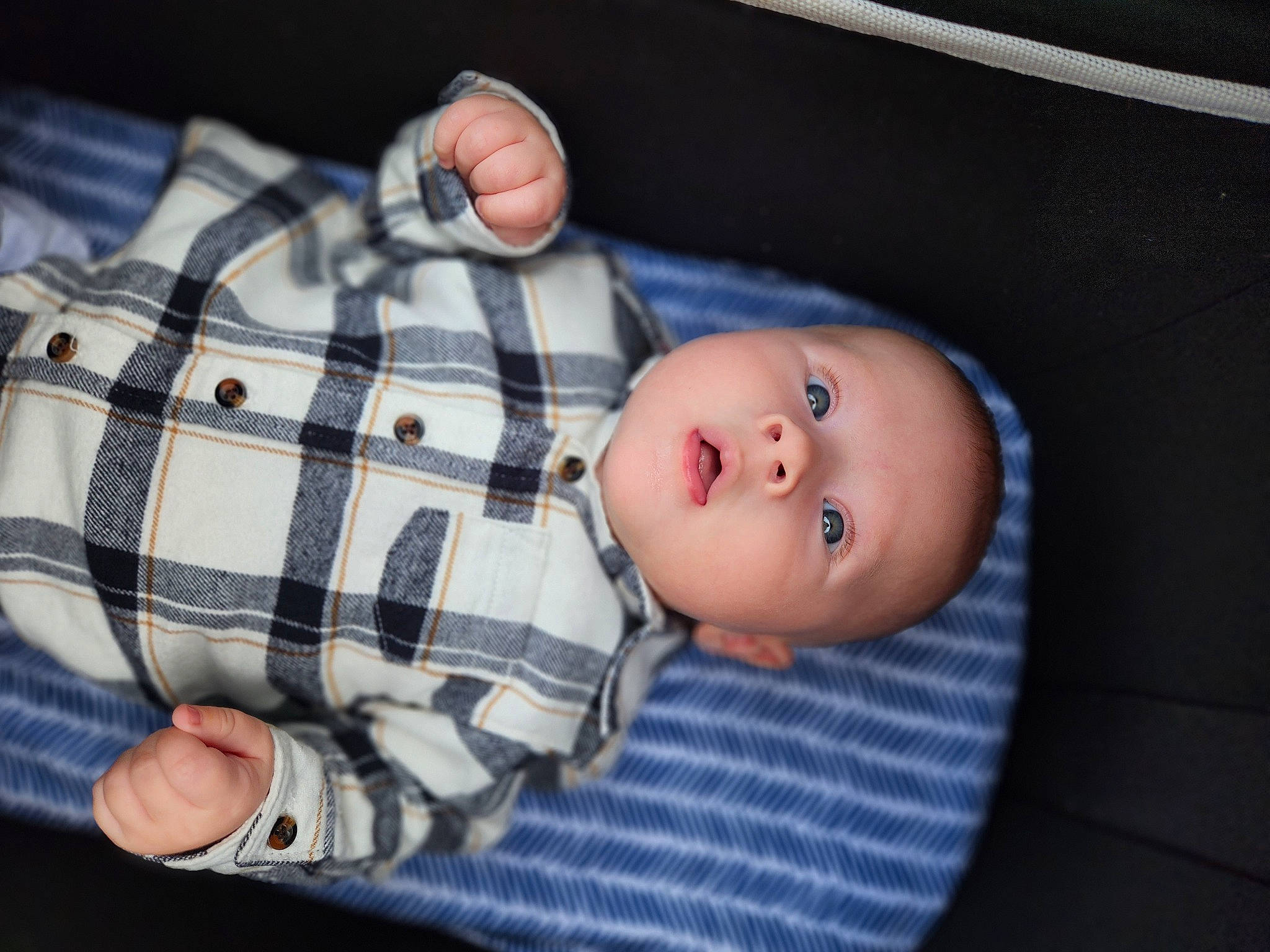 Darius joined the competition — help win amazing prizes! baby, baby_products, baby_toddler_clothing, cheek, child, comfort, finger, hand, linens, nose, pattern, person, plaid, room, sitting, skin, sleeve, tartan, toddler, wood